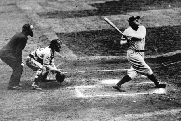 Babe Ruth of the New York Yankees clouts a towering home run in this undated photo. (AP Photo)