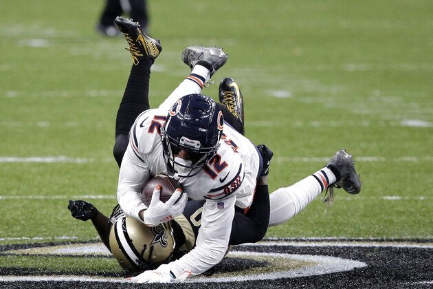 Chicago Bears wide receiver Allen Robinson (12) is tackled by New Orleans Saints cornerback Janoris Jenkins in the second half of an NFL wild-card playoff football game in New Orleans, Sunday, Jan. 10, 2021. (AP Photo/Butch Dill)
