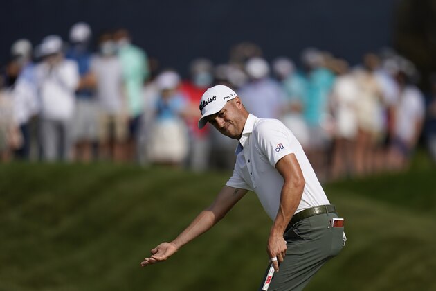 Justin Thomas reacts after missing a putt on the 18th hole during the third round of The Players Championship golf tournament Saturday, March 13, 2021, in Ponte Vedra Beach, Fla. (AP Photo/Gerald Herbert)