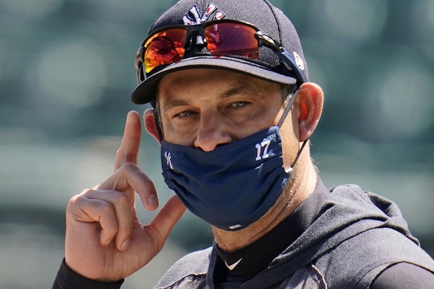 New York Yankees manager Aaron Boone watches batting practice before a spring training exhibition baseball game against the Detroit Tigers at Joker Marchant Stadium in Lakeland, Fla., Tuesday, March 9, 2021. (AP Photo/Gene J. Puskar