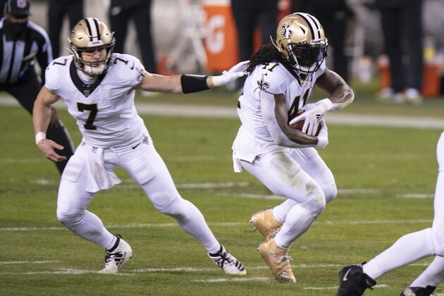 New Orleans Saints running back Alvin Kamara (41) takes the hand off from quarterback Taysom Hill (7) during the NFL football game against the Philadelphia Eagles, Sunday, Dec. 13, 2020, in Philadelphia. (AP Photo/Chris Szagola)