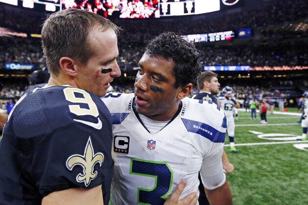 New Orleans Saints quarterback Drew Brees (9) greets Seattle Seahawks quarterback Russell Wilson (3) after an NFL football game in New Orleans, Sunday, Oct. 30, 2016. The Saints won 25-20.(AP Photo/Butch Dill)