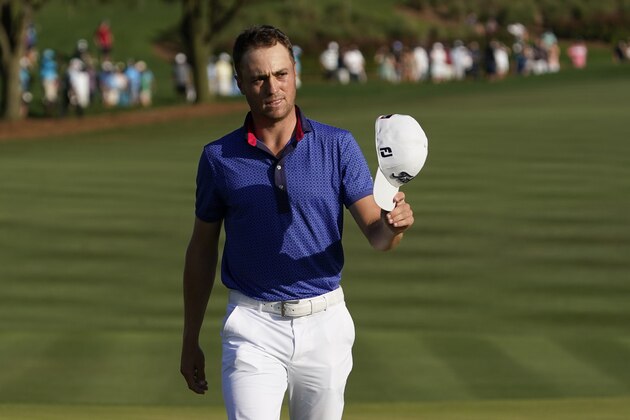 Justin Thomas waves on the 18th green after the final round of The Players Championship golf tournament Sunday, March 14, 2021, in Ponte Vedra Beach, Fla. (AP Photo/John Raoux)