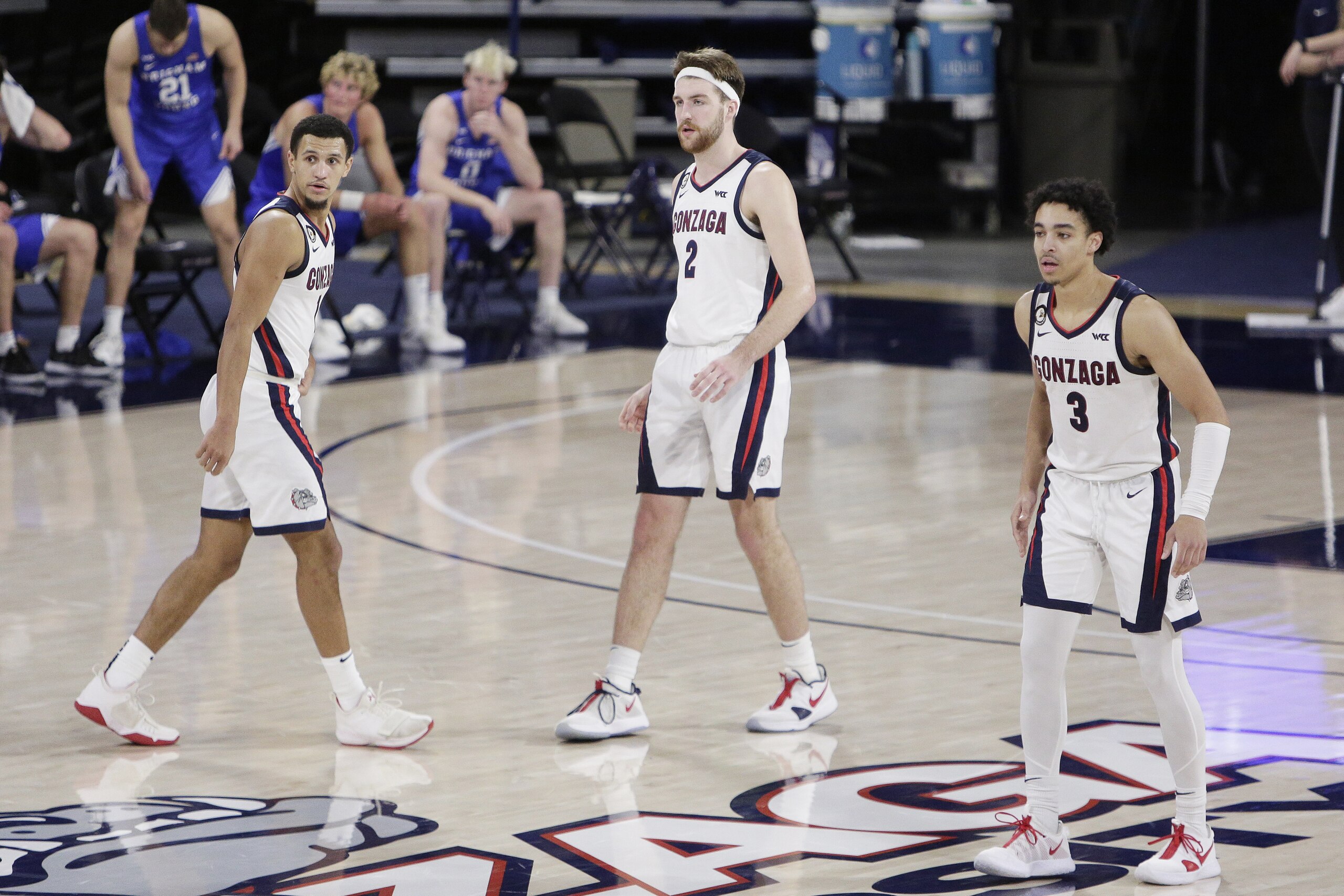 Gonzaga guard Jalen Suggs (1), forward Drew Timme (2) and guard Andrew Nembhard (3) prepare to defend during the second half of an NCAA college basketball game against BYU in Spokane, Wash., Thursday, Jan. 7, 2021. (AP Photo/Young Kwak)