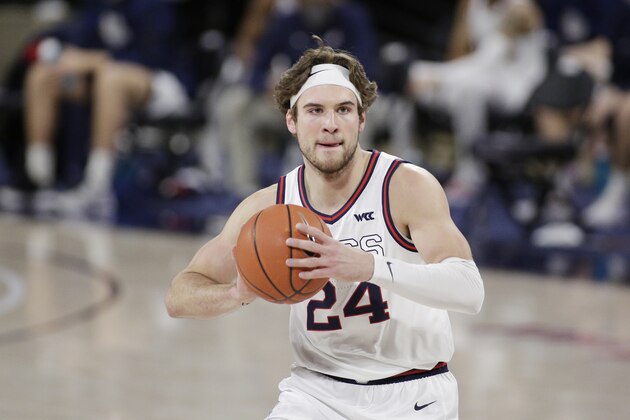 Gonzaga forward Corey Kispert prepares to pass the ball during the first half of an NCAA college basketball game against Loyola Marymount in Spokane, Wash., Saturday, Feb. 27, 2021. (AP Photo/Young Kwak)