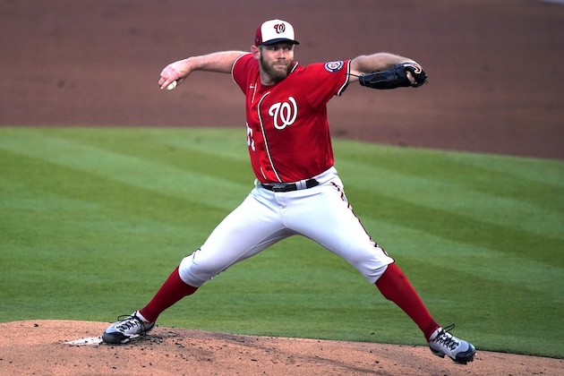 Washington Nationals starting pitcher Stephen Strasburg throws during the first inning of the team's spring training baseball game against the Houston Astros, Tuesday, March 9, 2021, in West Palm Beach, Fla. (AP Photo/Lynne Sladky)