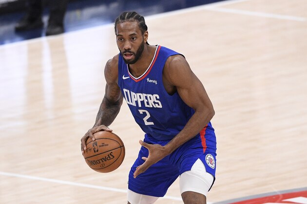 Los Angeles Clippers forward Kawhi Leonard (2) dribbles the ball during the second half of an NBA basketball game against the Washington Wizards, Thursday, March 4, 2021, in Washington. The Wizards won 119-117. (AP Photo/Nick Wass)