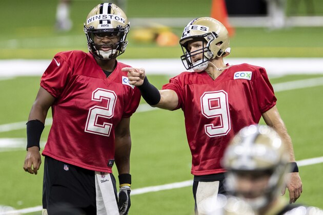 New Orleans Saints quarterback Drew Brees (9) talks with Jameis Winston (2) during an NFL football training camp practice at the Superdome in New Orleans, Saturday, Aug. 29, 2020. (David Grunfeld/The Advocate via AP, Pool)