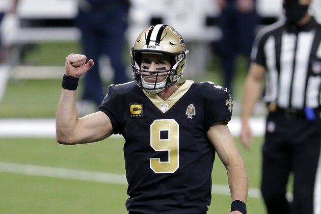 New Orleans Saints quarterback Drew Brees (9) reacts after throwing a touchdown pass to Michael Thomas in the first half of an NFL wild-card playoff football game against the Chicago Bears in New Orleans, Sunday, Jan. 10, 2021. (AP Photo/Brett Duke)