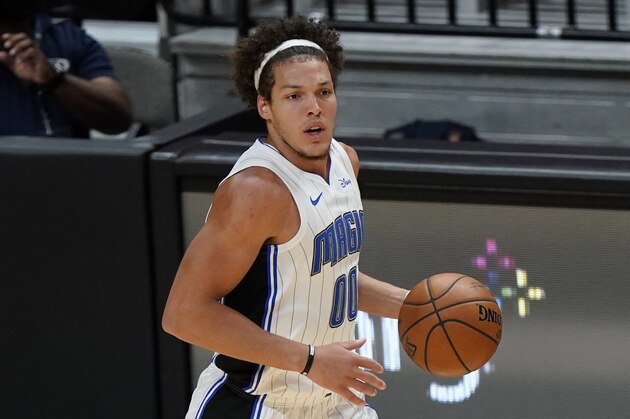 Orlando Magic forward Aaron Gordon takes the ball down court during the second half of an NBA basketball game against the Miami Heat, Thursday, March 11, 2021, in Miami. (AP Photo/Wilfredo Lee)