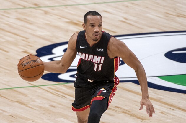 Miami Heat guard Avery Bradley (11) dribbles during an NBA basketball game against the Dallas Mavericks, Friday, Jan. 1, 2021, in Dallas. Dallas won 93-83. (AP Photo/Jeffrey McWhorter)