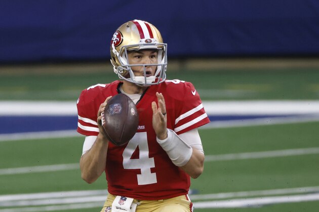 San Francisco 49ers quarterback Nick Mullens (4) looks to throw against the Dallas Cowboys during an NFL football game in Arlington, Texas, Sunday, Dec.20, 2020. (AP Photo/Ron Jenkins)