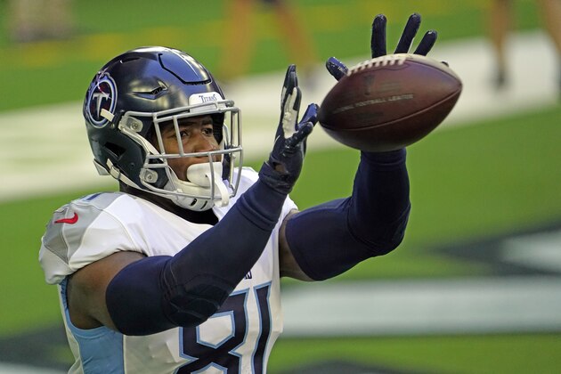 Tennessee Titans tight end Jonnu Smith catches a pass before an NFL football game against the Houston Texans Sunday, Jan. 3, 2021, in Houston. (AP Photo/Sam Craft)