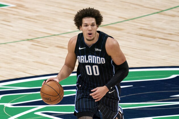 Orlando Magic forward Aaron Gordon (00) brings the ball up the court during an NBA basketball game against the Dallas Mavericks, Saturday, Jan. 9, 2021, in Dallas. Dallas won 112-98. (AP Photo/Jeffrey McWhorter)