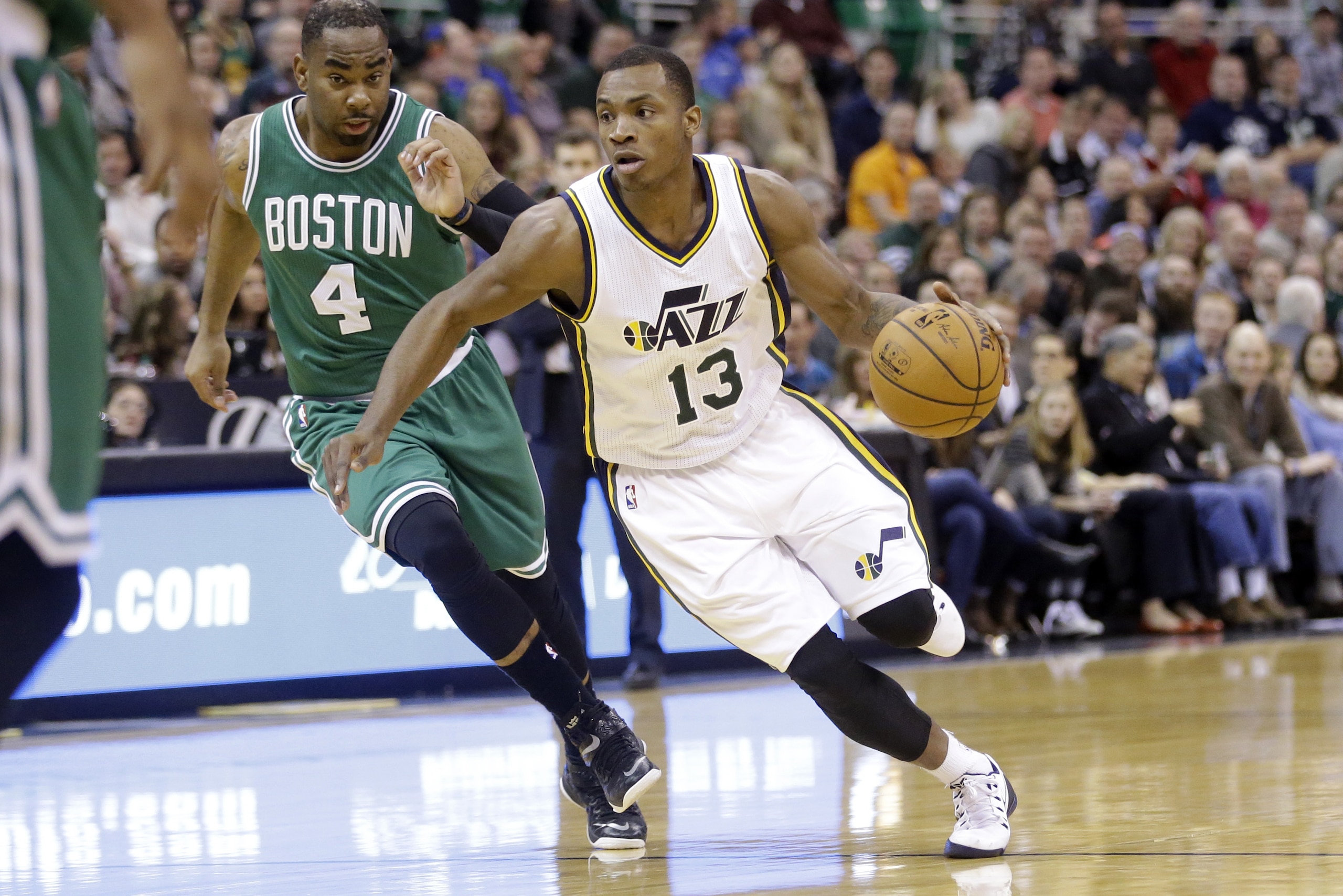 Utah Jazz guard Elijah Millsap (13) drives around Boston Celtics guard Marcus Thornton (4) in the third quarter during an NBA basketball game Monday, Jan. 26, 2015, in Salt Lake City. The Celtics won 99-90. (AP Photo/Rick Bowmer)