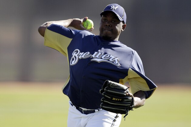 Milwaukee Brewers' Frankie De La Cruz throws during a spring training baseball workout Thursday, Feb. 23, 2012, in Phoenix. (AP Photo/Morry Gash)