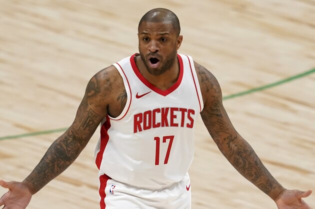 Houston Rockets' P.J. Tucker gestures at an official during an NBA basketball game against the Dallas Mavericks in Dallas, Saturday, Jan. 23, 2021. (AP Photo/Tony Gutierrez)