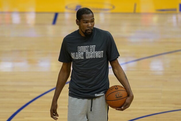 Brooklyn Nets forward Kevin Durant wears a Black History Month shirt as he warms up before an NBA basketball game against the Golden State Warriors in San Francisco, Saturday, Feb. 13, 2021. (AP Photo/Jeff Chiu)