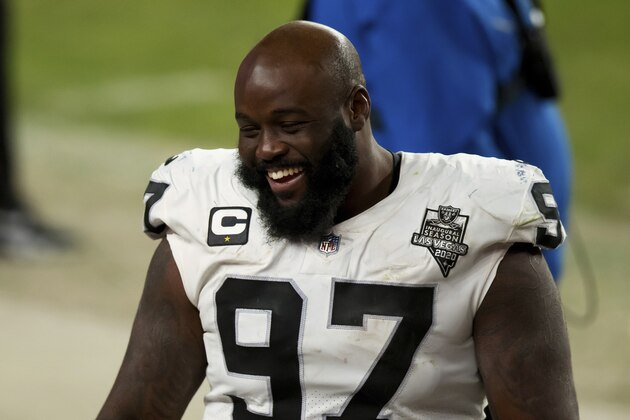 Las Vegas Raiders defensive tackle Maliek Collins (97) laughs on the sidelines against the Denver Broncos during the second half of an NFL football game, Sunday, Jan.. 3, 2021, in Denver. (AP Photo/Justin Edmonds)