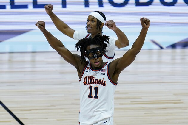 Illinois guard Ayo Dosunmu (11) celebrates after defeating Ohio State 91-88 in overtime in a NCAA college basketball championship game at the Big Ten Conference tournament, Sunday, March 14, 2021, in Indianapolis. (AP Photo/Michael Conroy)