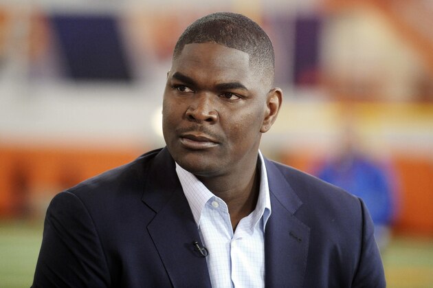 FILE - In this March 6, 2014, file photo, former NFL and Southern California receiver Keyshawn Johnson appears during the Clemson NCAA college football pro day in Clemson, S.C. The Los Angeles County Sheriff's Department says Johnson has been arrested after a report of a domestic dispute. A Sheriff's Department statement says deputies responded to a residence in Calabasas at 12:48 a.m. Monday, April 21, 2014, and determined the resident, subsequently identified as Johnson, and his ex-girlfriend were involved in a domestic dispute, and the resident was arrested for misdemeanor domestic battery. (AP Photo/Rainier Ehrhardt, File)