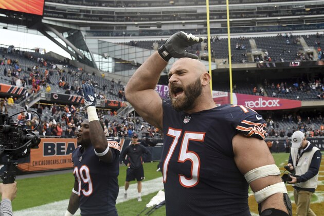 Chicago Bears offensive guard Kyle Long (75) and defensive back Eddie Jackson (39) celebrate after an NFL football game against the Tampa Bay Buccaneers Sunday, Sept. 30, 2018, in Chicago. The Bears won 48-10. (AP Photo/David Banks)