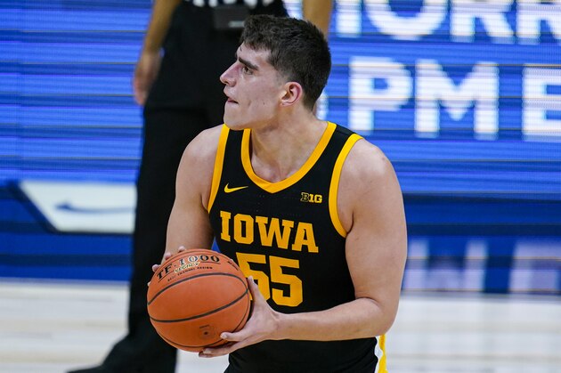 Iowa center Luka Garza (55) plays against Illinois in the first half of an NCAA college basketball game at the Big Ten Conference tournament in Indianapolis, Saturday, March 13, 2021. (AP Photo/Michael Conroy)