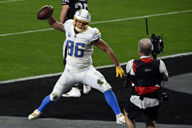 A broadcast cameraman records Los Angeles Chargers tight end Hunter Henry (86) reacting after scoring a touchdown against the Las Vegas Raiders during an NFL football game, Sunday, Dec. 17, 2020, in Las Vegas. (AP Photo/David Becker) A broadcast cameraman records Los Angeles Chargers tight end Hunter Henry (86) reacting after scoring a touchdown against the Las Vegas Raiders during an NFL football game, Sunday, Dec. 17, 2020, in Las Vegas. (AP Photo/David Becker)