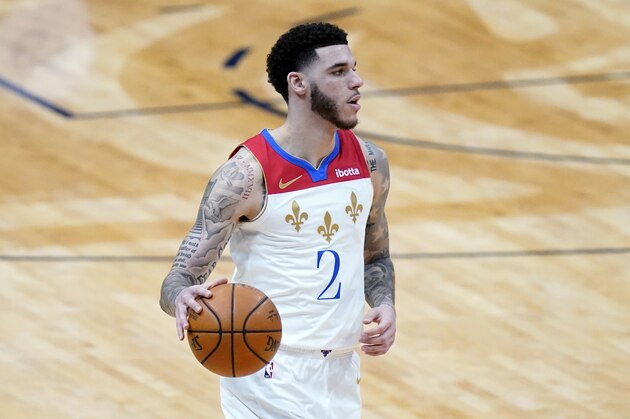 New Orleans Pelicans guard Lonzo Ball (2) moves the ball down court in the first half of an NBA basketball game against the Phoenix Suns in New Orleans, Friday, Feb. 19, 2021. (AP Photo/Gerald Herbert)