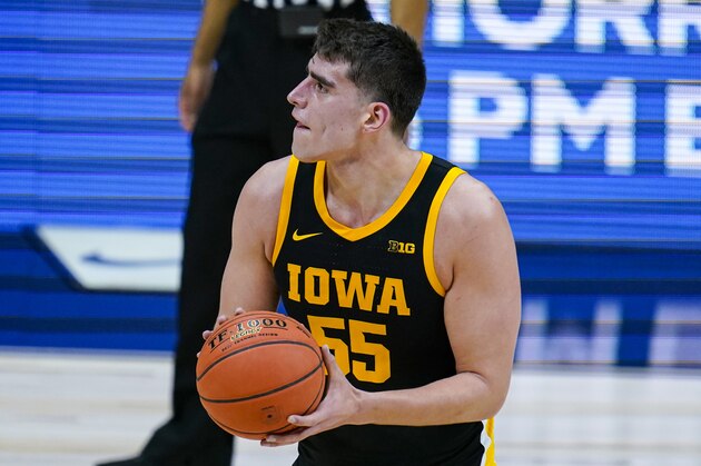 Iowa center Luka Garza (55) plays against Illinois in the first half of an NCAA college basketball game at the Big Ten Conference tournament in Indianapolis, Saturday, March 13, 2021. (AP Photo/Michael Conroy)