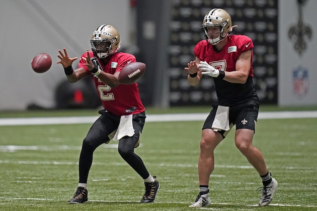 New Orleans Saints quarterbacks Jameis Winston (2) and quarterback Taysom Hill (7) go through drills during practice at their NFL football training facility in Metairie, La., Sunday, Aug. 23, 2020. (AP Photo/Gerald Herbert, Pool)