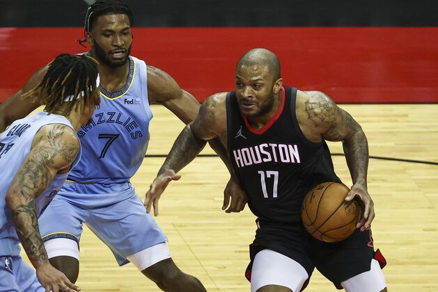 Houston Rockets forward P.J. Tucker (17) dribbles against the Memphis Grizzlies during the second quarter of an NBA basketball game Sunday, Feb. 28, 2021, in Houston. (Troy Taormina/Pool Photo via AP)