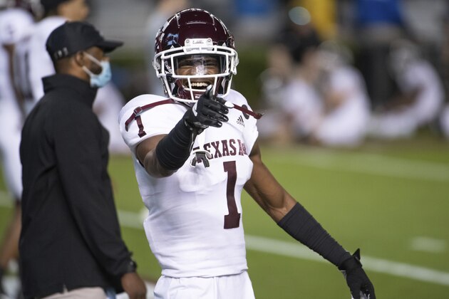 Texas A&M wide receiver Demond Demas (1) shares a laugh during warm-ups before an NCAA college football game Saturday, Nov. 7, 2020, in Columbia, S.C. Texas A&M won 48-3. (AP Photo/Sean Rayford)