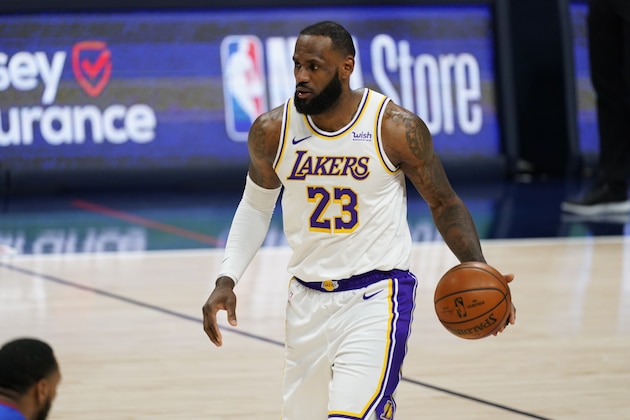 Los Angeles Lakers forward LeBron James (23) in the second half of an NBA basketball game Sunday, Feb. 14, 2021, in Denver. (AP Photo/David Zalubowski)