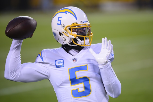 Los Angeles Chargers quarterback Tyrod Taylor (5) warms up before the second half of an NFL football game against the Kansas City Chiefs, Sunday, Jan. 1, 2021, in Kansas City, Mo. (AP Photo/Reed Hoffmann)