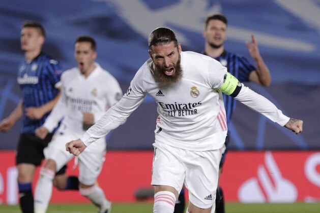 Real Madrid's Sergio Ramos celebrates scoring his side's 2nd goal during the Champions League, round of 16, second leg soccer match between Atalanta and Real Madrid at the Alfredo di Stefano stadium in Madrid, Spain, Tuesday, March 16, 2021. (AP Photo/Bernat Armangue)