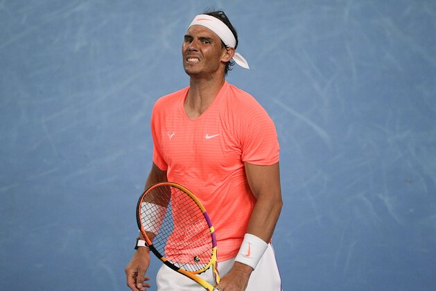 Spain's Rafael Nadal reacts after losing a point against Greece's Stefanos Tsitsipas during their quarterfinal match at the Australian Open tennis championship in Melbourne, Australia, Wednesday, Feb. 17, 2021.(AP Photo/Andy Brownbill)