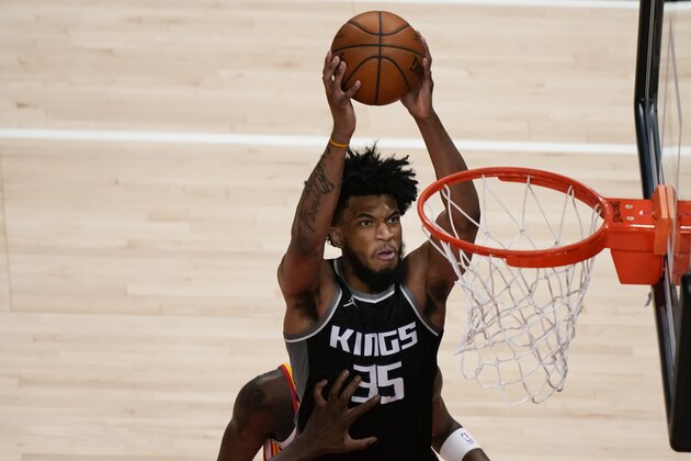 Sacramento Kings' Marvin Bagley III (35) scores against the Atlanta Hawks during the first half of an NBA basketball game on Saturday, March 13, 2021, in Atlanta. (AP Photo/Brynn Anderson)
