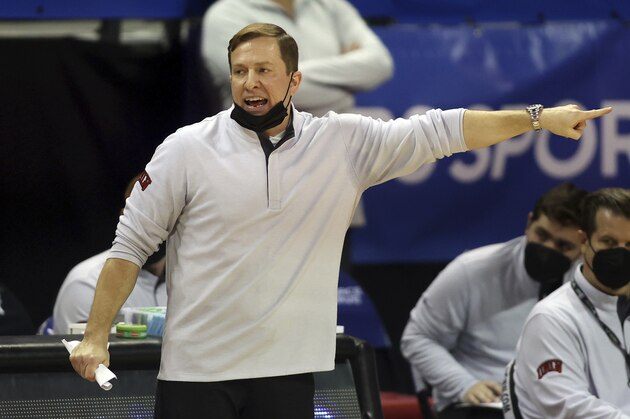 UNLV head coach T.J. Otzelberger instructs his team during the second half of an NCAA college basketball game against Utah State in the quarterfinals of the Mountain West Conference men's tournament Thursday, March 11, 2021, in Las Vegas. (AP Photo/Isaac Brekken)
