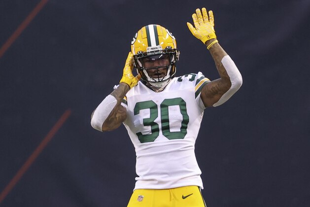 Green Bay Packers running back Jamaal Williams (30) dances during the first half of an NFL football game against the Chicago Bears, Sunday, Jan. 3, 2021, in Chicago. (AP Photo/Kamil Krzaczynski)