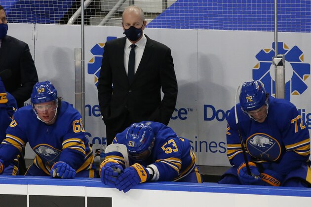 Buffalo Sabres head coach Ralph Krueger, top center, looks on during the third period of an NHL hockey game against the Pittsburgh Penguins, Saturday, March 13, 2021, in Buffalo, N.Y. (AP Photo/Jeffrey T. Barnes)