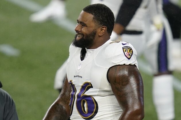 Baltimore Ravens defensive tackle Broderick Washington warms up before an NFL football game against the New England Patriots, Sunday, Nov. 15, 2020, in Foxborough, Mass. (AP Photo/Charles Krupa)