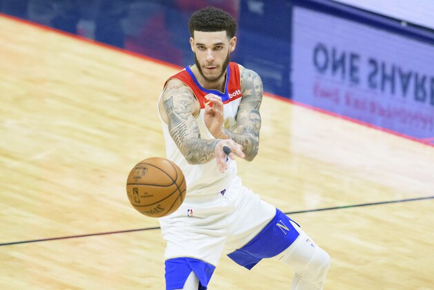 New Orleans Pelicans guard Lonzo Ball (2) passes in the second half of an NBA basketball game against the Cleveland Cavaliers in New Orleans, Friday, March 12, 2021. (AP Photo/Matthew Hinton)