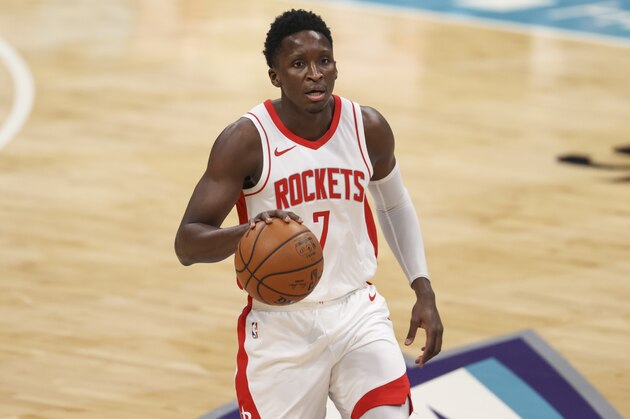 Houston Rockets guard Victor Oladipo (7) brings the ball up court against the Charlotte Hornets in the first half of an NBA basketball game in Charlotte, N.C., Monday, Feb. 8, 2021. (AP Photo/Nell Redmond)