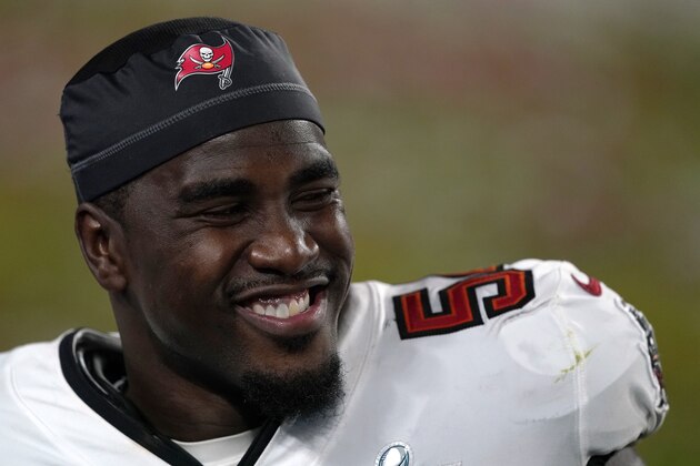 Tampa Bay Buccaneers inside linebacker Lavonte David (54) smiles on the field after the NFL Super Bowl 55 football game against the Kansas City Chiefs, Sunday, Feb. 7, 2021, in Tampa, Fla. The Tampa Bay Buccaneers defeated the Kansas City Chiefs 31-9. (AP Photo/Steve Luciano)
