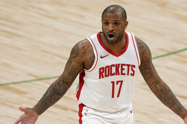 Houston Rockets' P.J. Tucker gestures at an official during an NBA basketball game against the Dallas Mavericks in Dallas, Saturday, Jan. 23, 2021. (AP Photo/Tony Gutierrez)