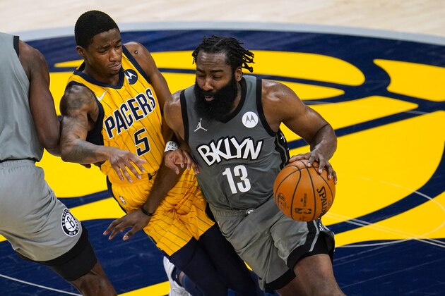 Brooklyn Nets guard James Harden (13) drives around Indiana Pacers guard Edmond Sumner (5) during the second half of an NBA basketball game in Indianapolis, Wednesday, March 17, 2021. The Nets won 124-115. (AP Photo/Michael Conroy)