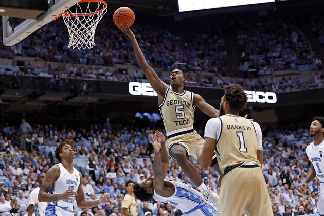 Georgia Tech forward Moses Wright (5) drives to the basket against North Carolina guard Jeremiah Francis while forward Armando Bacot (5) looks on at left during the second half of an NCAA college basketball game in Chapel Hill, N.C., Saturday, Jan. 4, 2020. (AP Photo/Gerry Broome)