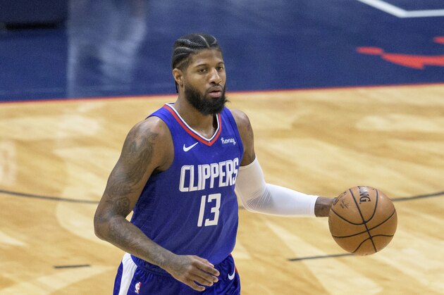 Los Angeles Clippers guard Paul George (13) dribbles in the first half of an NBA basketball game against the New Orleans Pelicans in New Orleans, Sunday, March 14, 2021. (AP Photo/Matthew Hinton)