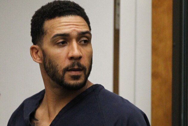 FILE - In this June 15, 2018, file photo, former NFL football player Kellen Winslow Jr., center, leaves his arraignment in Vista, Calif. Winslow, a former NFL No. 1 draft pick and son of a Hall of Famer who starred for his hometown San Diego Chargers, goes on trial Monday, May 20, 2019, on multiple charges including raping two women last year and raping an unconscious 17-year-old girl. He has pleaded not guilty to all charges.(Hayne Palmour/San Diego Union-Tribune via AP, Pool, File)